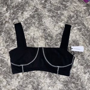Never worn with tags WEWOREWHAT active wear corset top in black